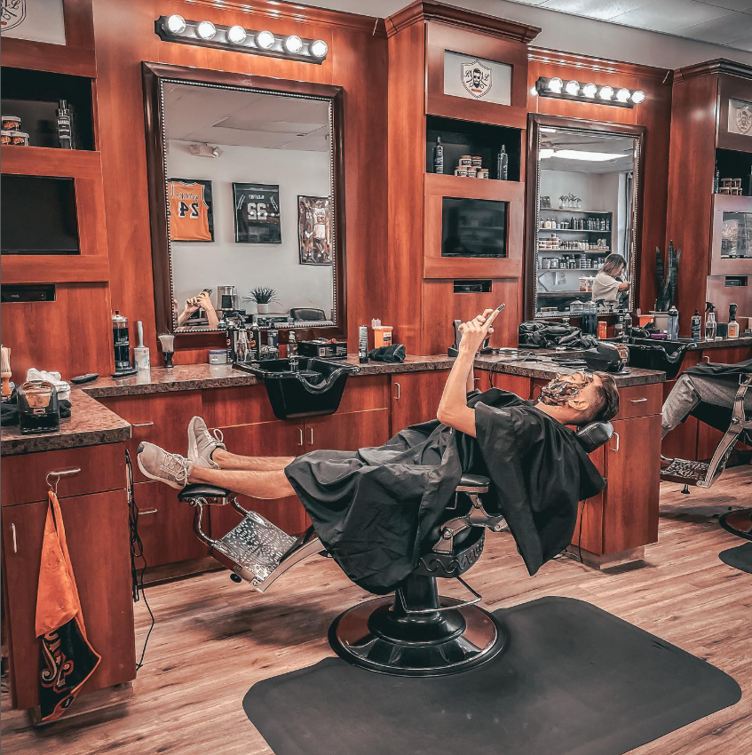 man reclining in barbers chair